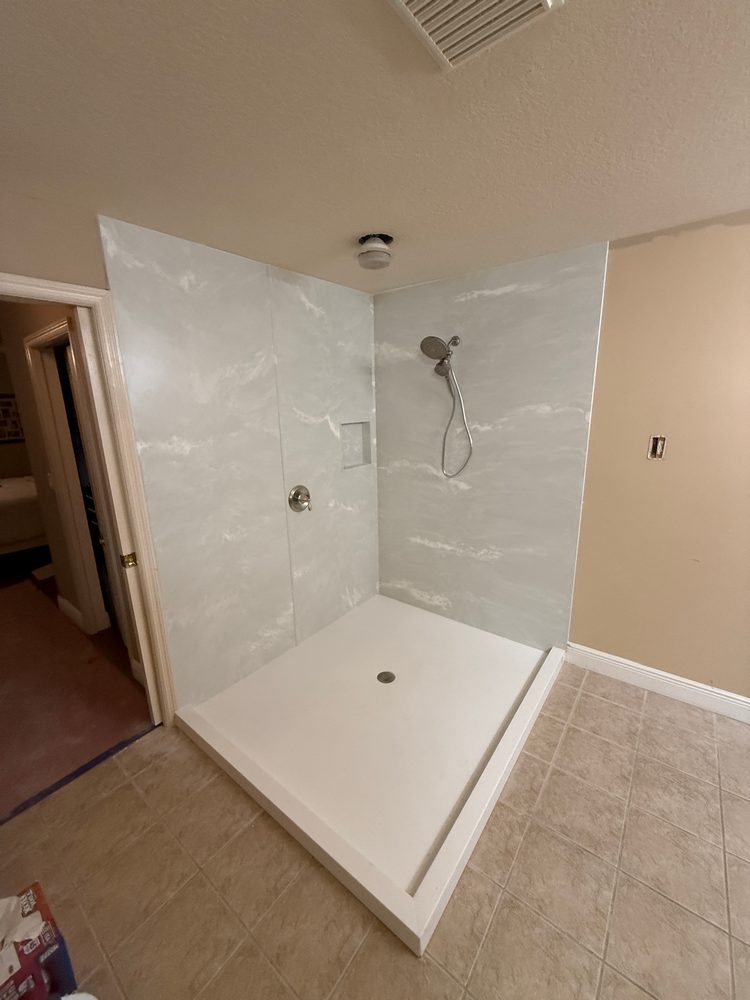 Bath Concepts of Florida completed a walk-in shower remodel in Naples, FL, replacing an older tile shower with a modern, low-maintenance shower system designed for comfort and style.